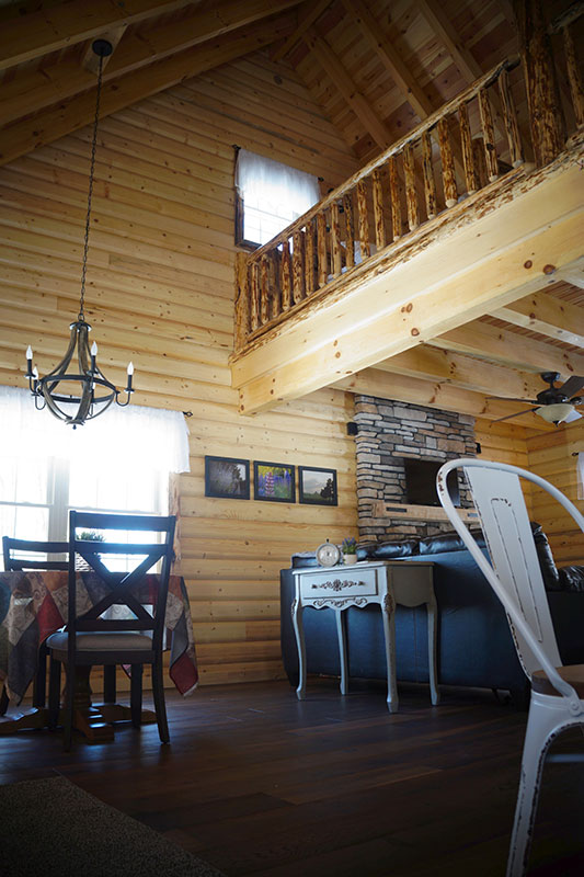 log cabin interior showing loft